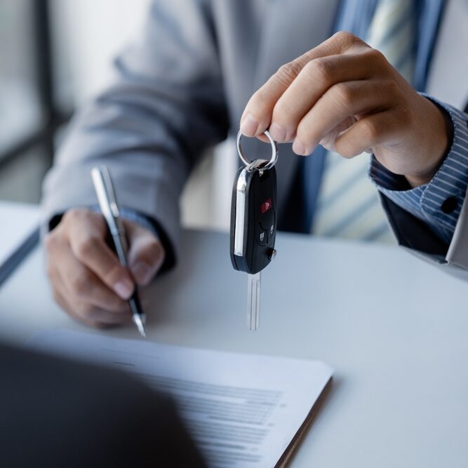 The,Car,Salesman,Hands,The,Key,To,The,Customer,After