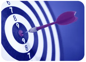 Dart stuck in the bullseye at the center of a numbered dartboard