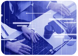 Overhead view of two people working at a laptop with line and bar graphic overlays