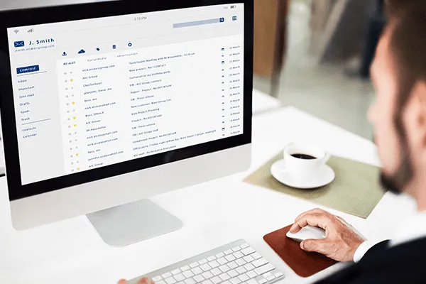 businessman looking at his email in his laptop