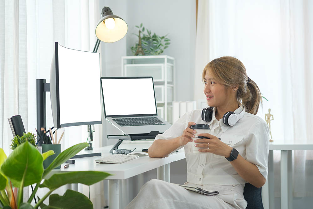 web designer reviewing a website on a large monitor