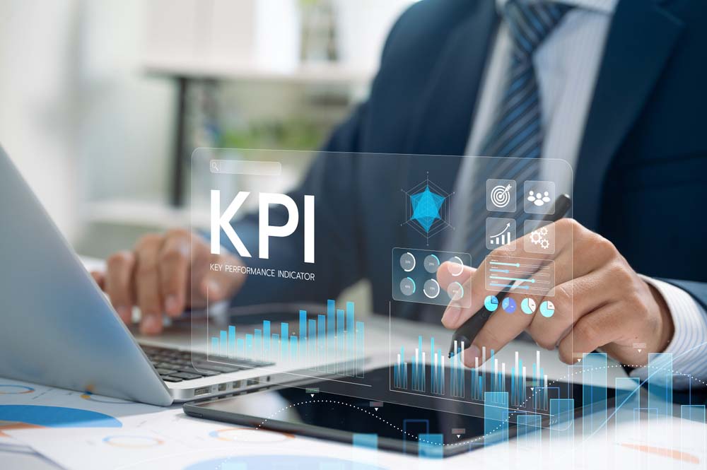 Business Professional Analyzing KPI Data on Digital Dashboard for Performance Management and Growth in Modern Office Environment