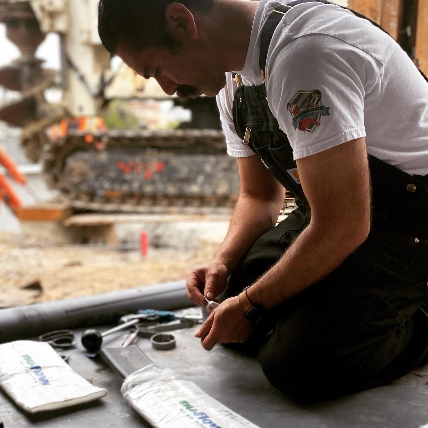 plumber fixing his gears