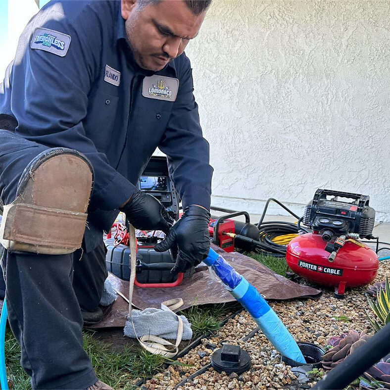 plumber installing new pipe