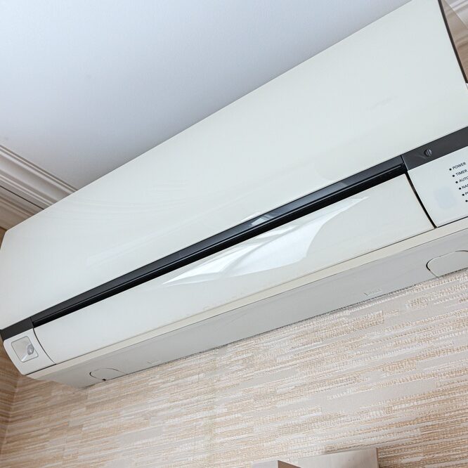 A,Sleek,White,Wall-mounted,Air,Conditioner,Unit,With,A,Control